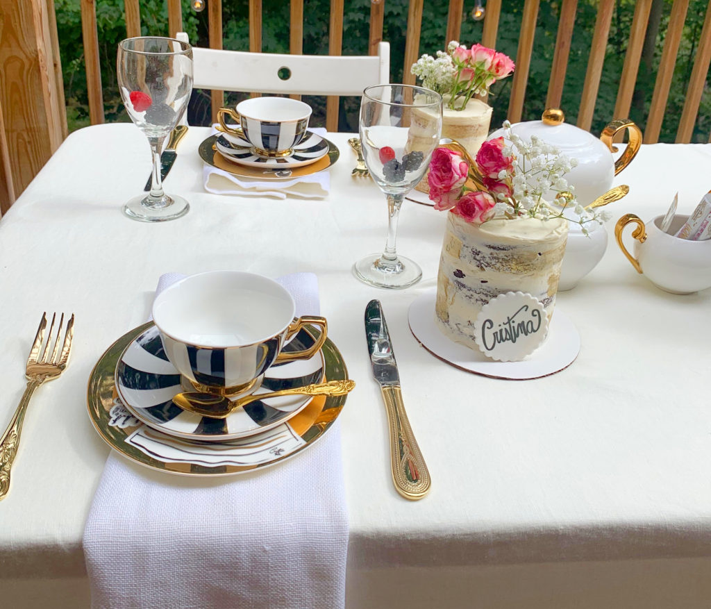 tea party table setting with teacup and flowers nj mom